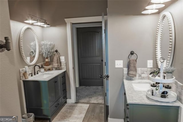 bathroom featuring vanity and hardwood / wood-style floors