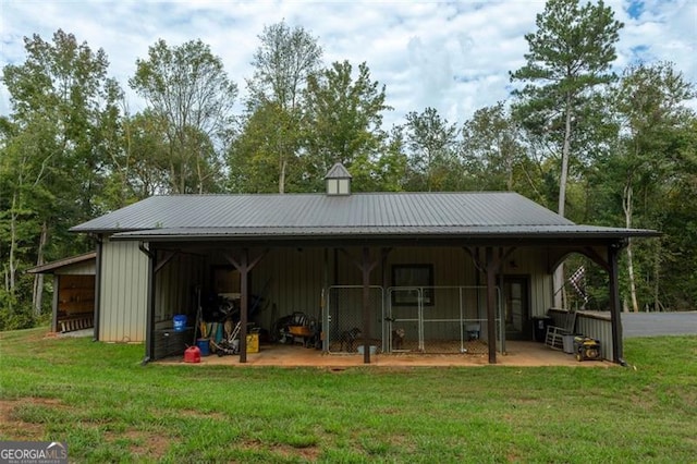 rear view of house with a yard