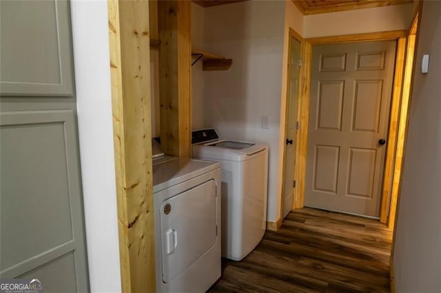 laundry room with dark wood-type flooring and washing machine and dryer