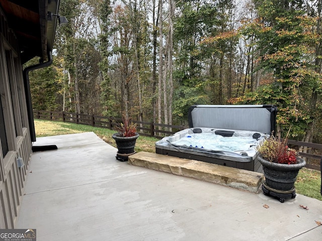 view of patio with a covered hot tub