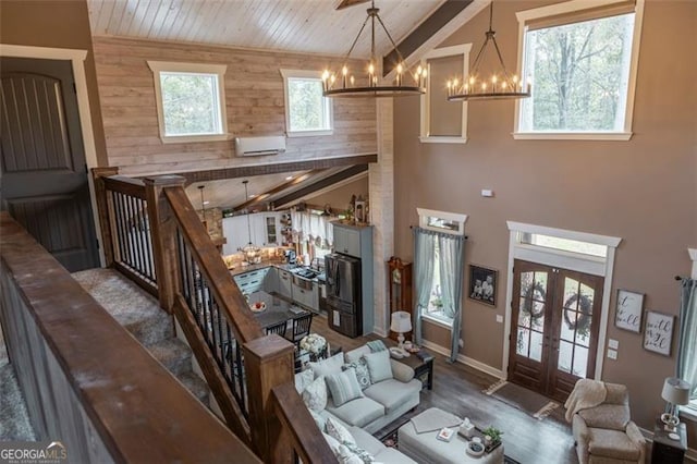 living room featuring a wall unit AC, high vaulted ceiling, wooden ceiling, dark wood-type flooring, and french doors