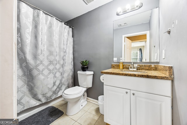 bathroom featuring vanity, tile patterned flooring, toilet, and curtained shower