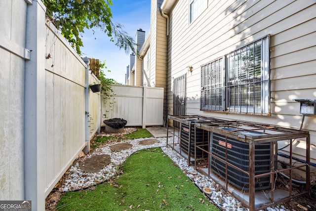 view of yard with a patio and central AC unit