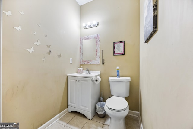 bathroom with vanity, tile patterned flooring, and toilet