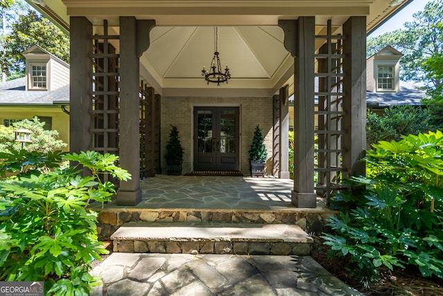 property entrance featuring french doors