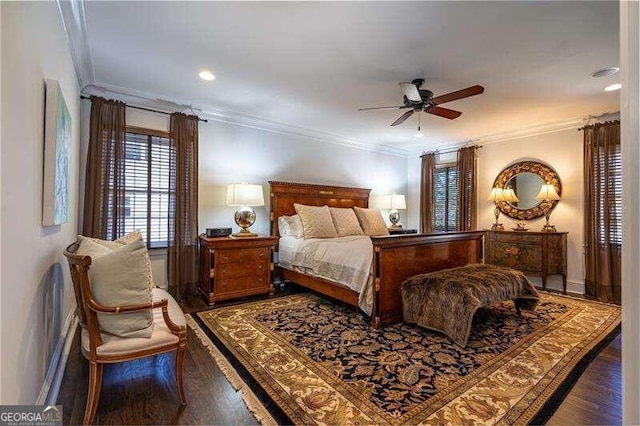 bedroom featuring ceiling fan, crown molding, and wood-type flooring