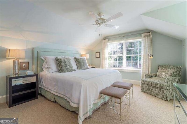 bedroom with lofted ceiling, light carpet, and ceiling fan