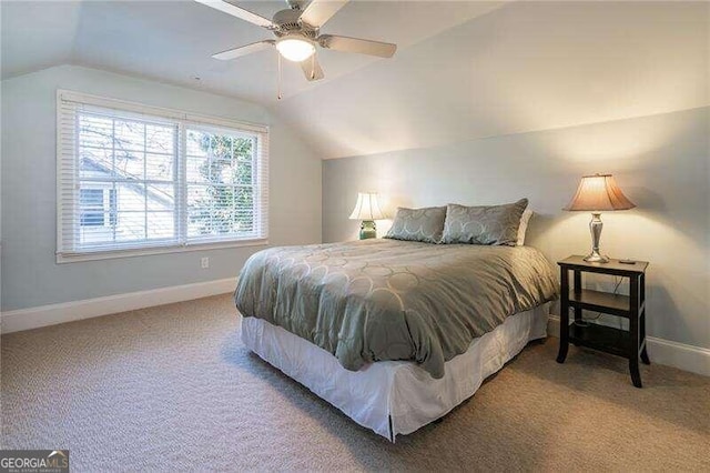 carpeted bedroom with lofted ceiling and ceiling fan