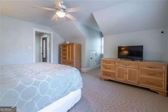 carpeted bedroom featuring ceiling fan and lofted ceiling