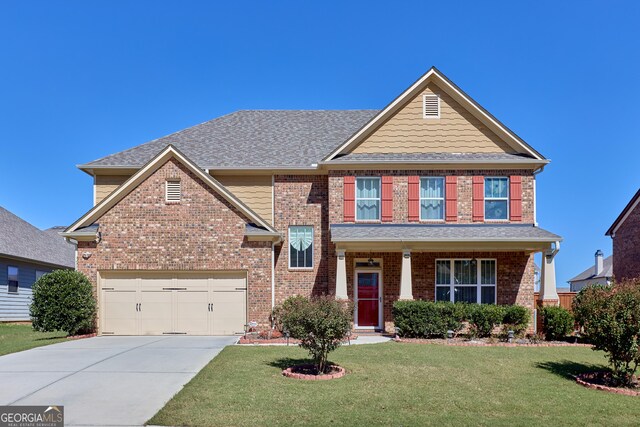 craftsman-style house with a front lawn and a garage