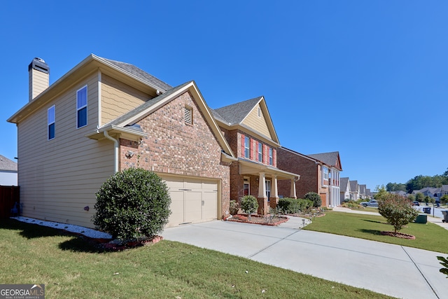 view of side of property featuring a garage and a lawn