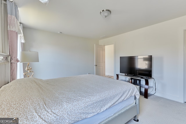 bedroom with light colored carpet