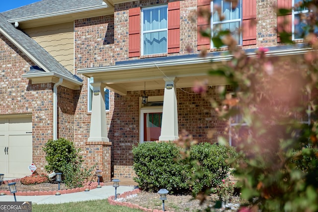 view of exterior entry with covered porch