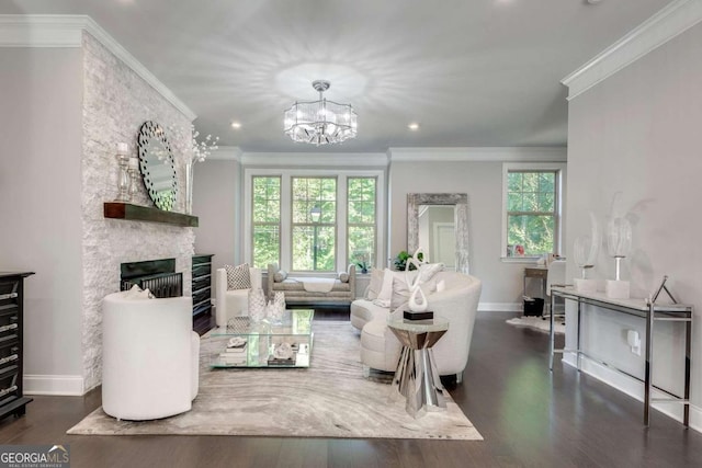 living room with a stone fireplace, dark hardwood / wood-style floors, ornamental molding, and a wealth of natural light