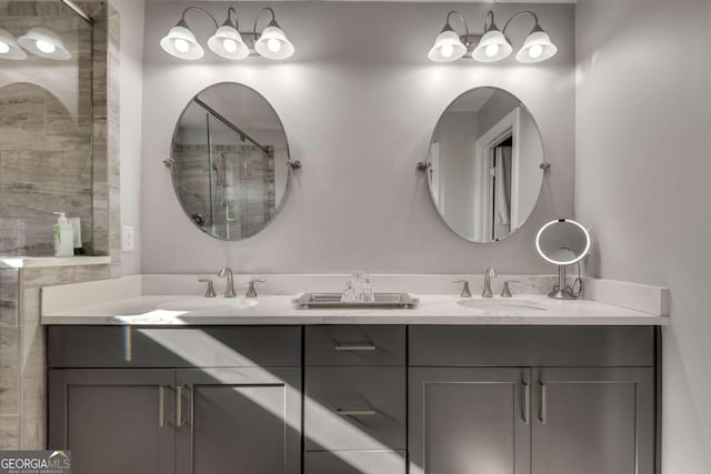 bathroom with an enclosed shower and vanity