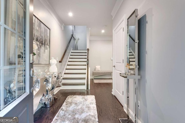 interior space featuring ornamental molding and hardwood / wood-style flooring