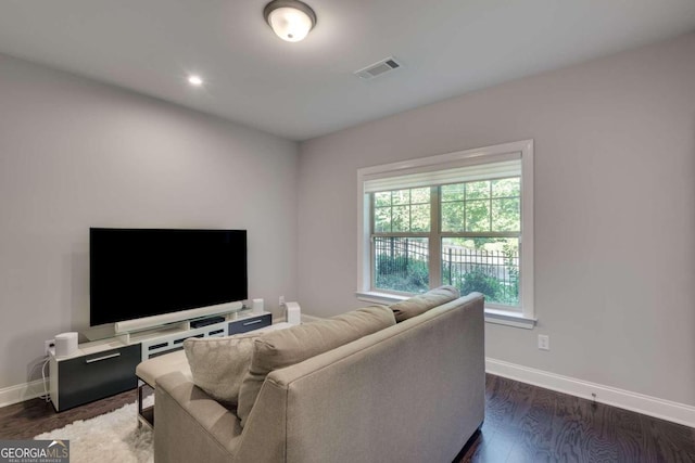 living room with dark hardwood / wood-style floors