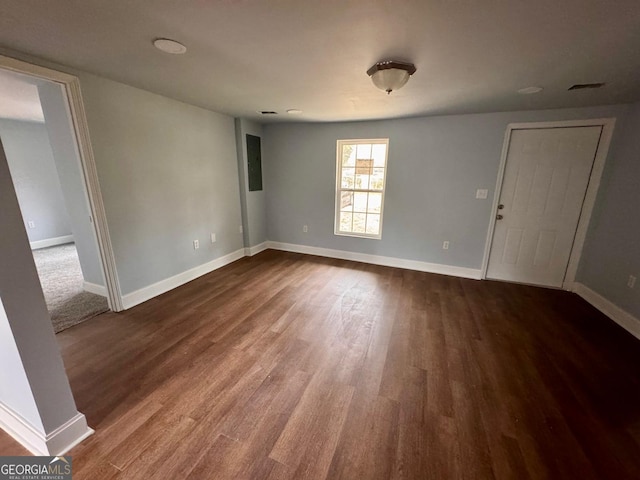 unfurnished room with hardwood / wood-style floors