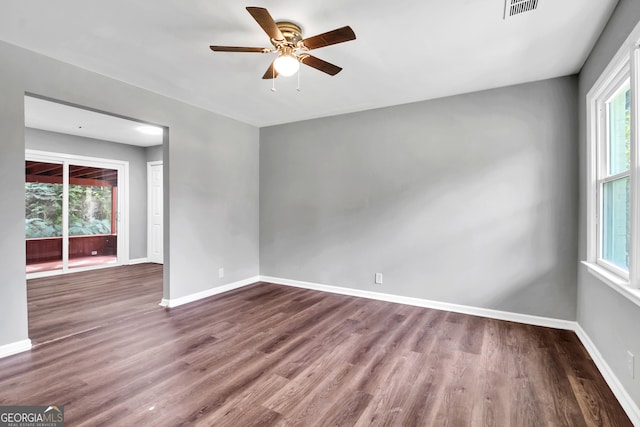 spare room with ceiling fan and hardwood / wood-style floors