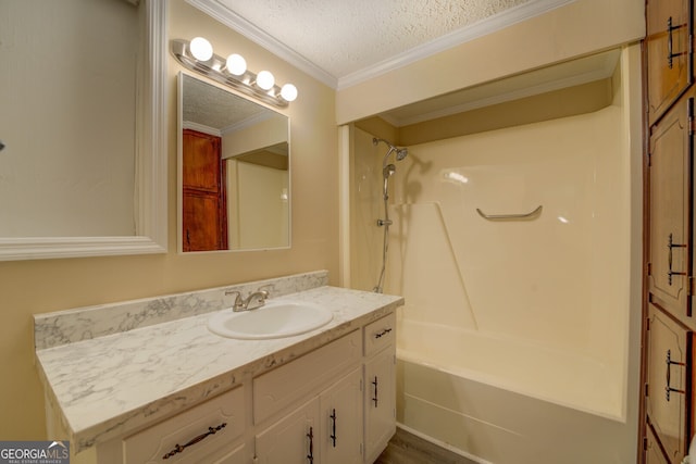 bathroom with vanity, crown molding, a textured ceiling, and shower / bathtub combination