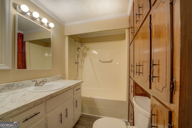 full bathroom featuring a textured ceiling, toilet, shower / bathtub combination, vanity, and crown molding