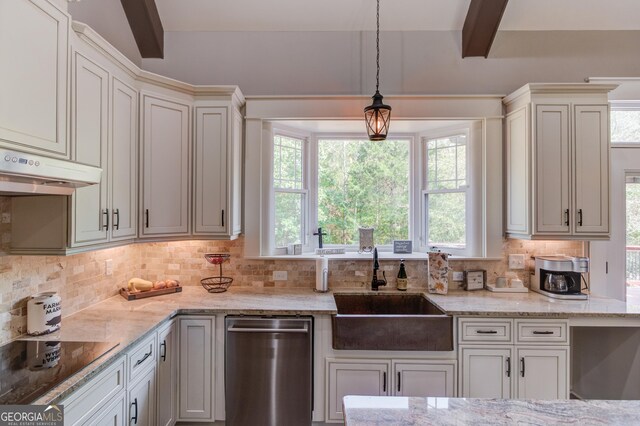 kitchen featuring sink, black electric cooktop, decorative light fixtures, stainless steel dishwasher, and light stone counters