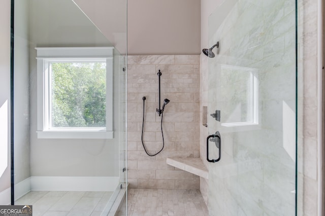 bathroom with tile patterned floors and an enclosed shower