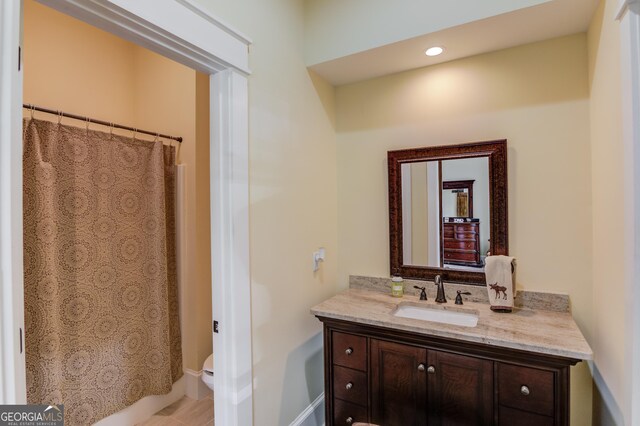 bathroom with vanity and toilet