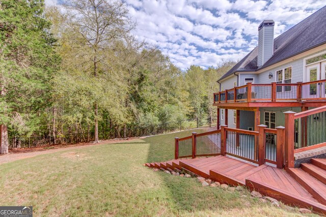 view of yard with a wooden deck