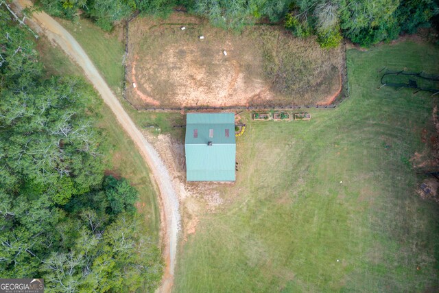 birds eye view of property with a rural view