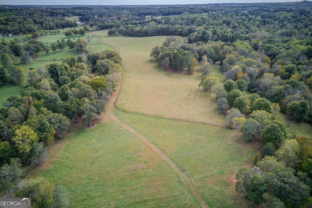 birds eye view of property with a rural view