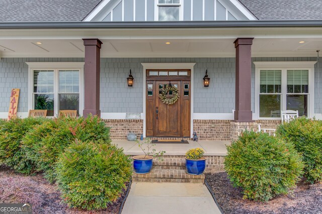 view of patio / terrace featuring covered porch and a garage