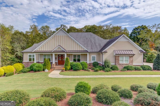 craftsman-style home with a front yard and a porch