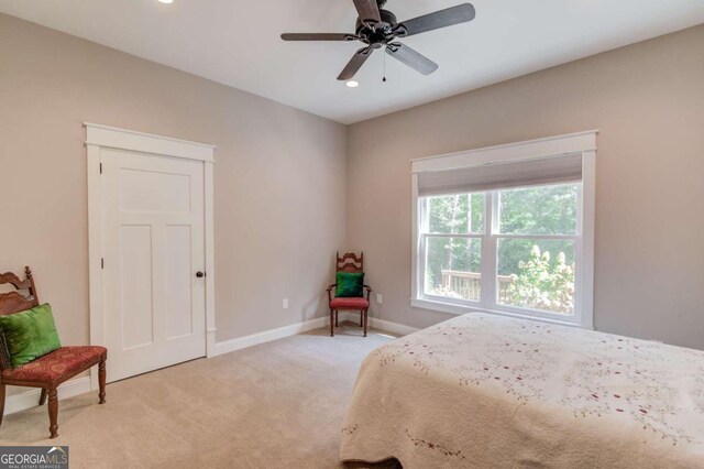 carpeted bedroom with ceiling fan