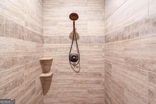 room details with a tile shower