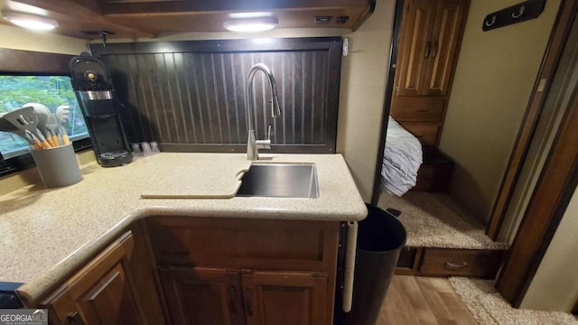 kitchen with light hardwood / wood-style floors and sink