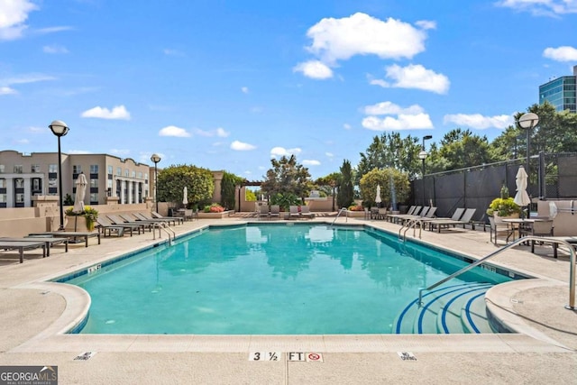 view of swimming pool featuring a patio area