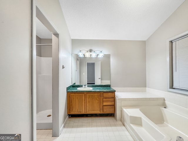 bathroom featuring lofted ceiling, tile patterned flooring, separate shower and tub, vanity, and a textured ceiling