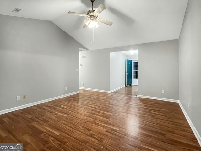 spare room featuring ceiling fan, wood-type flooring, and vaulted ceiling