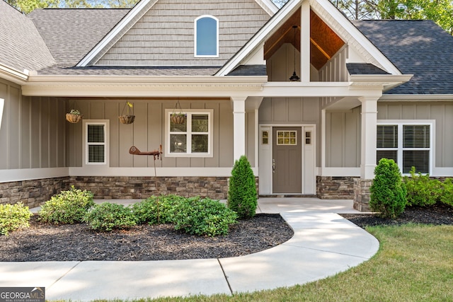 view of exterior entry with a porch