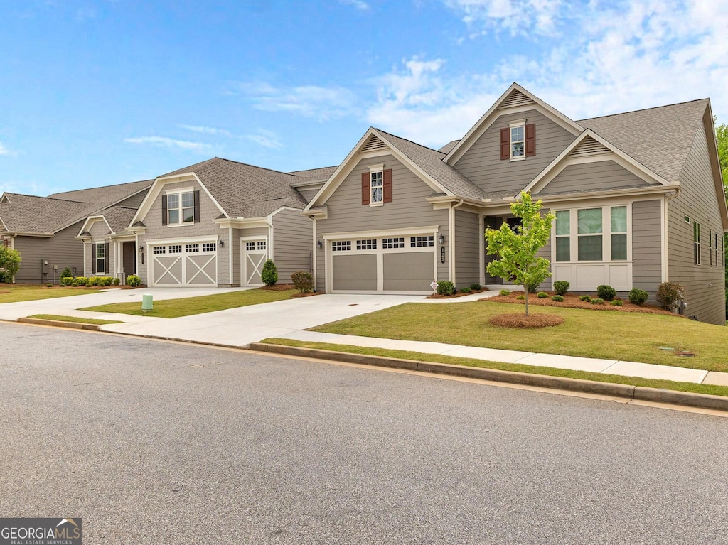 craftsman-style house with a garage and a front yard