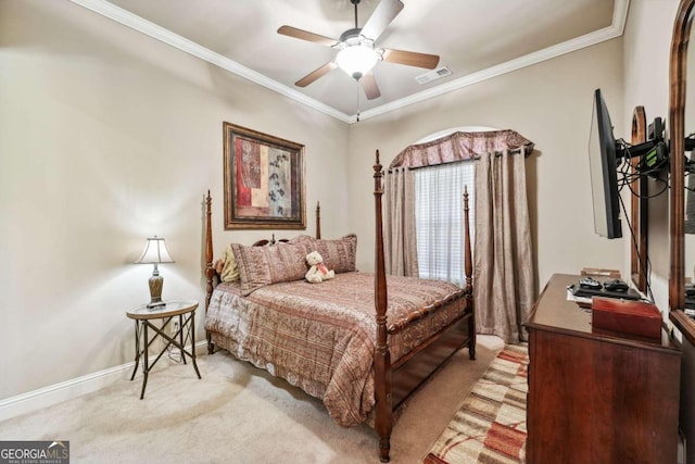 carpeted bedroom featuring ornamental molding and ceiling fan