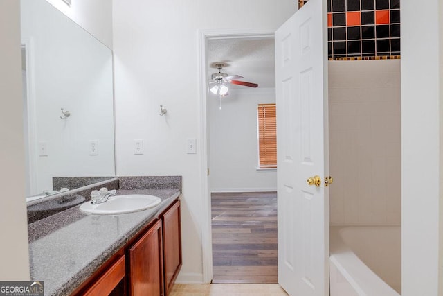 516 Jaclyn Cir, Mcdonough, GA 30253 - bathroom with vanity, ceiling fan, and wood finished floors