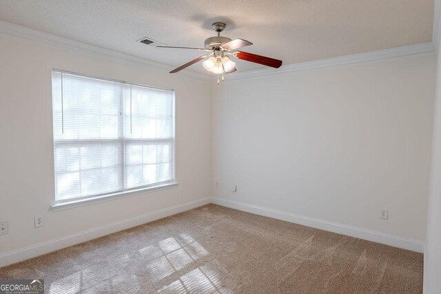 516 Jaclyn Cir, Mcdonough, GA 30253 - spare room featuring crown molding, carpet floors, and a ceiling fan