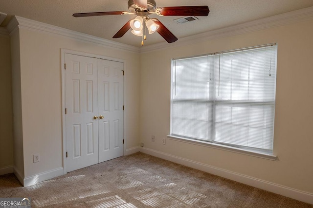 516 Jaclyn Cir, Mcdonough, GA 30253 - unfurnished bedroom featuring light carpet, a closet, crown molding, and a ceiling fan