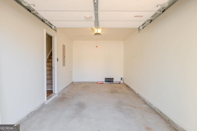 516 Jaclyn Cir, Mcdonough, GA 30253 - garage featuring a garage door opener and electric panel