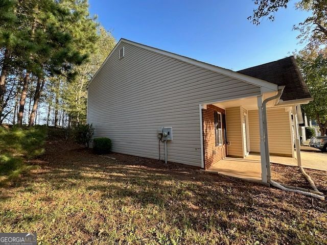 516 Jaclyn Cir, Mcdonough, GA 30253 - view of side of home with brick siding and a porch