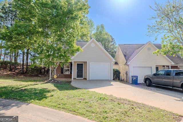 516 Jaclyn Cir, Mcdonough, GA 30253 - view of front facade with concrete driveway, a garage, and a front yard