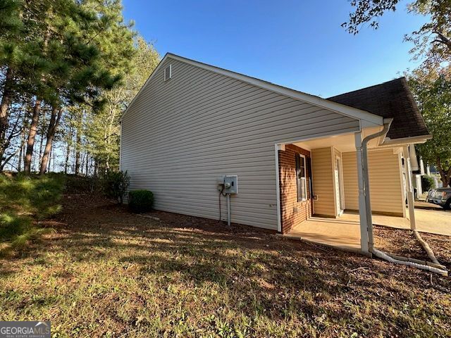 back of property featuring a patio area