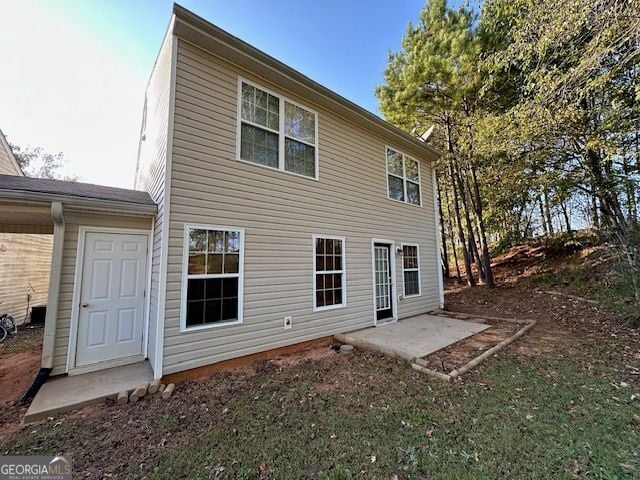 rear view of property featuring a patio